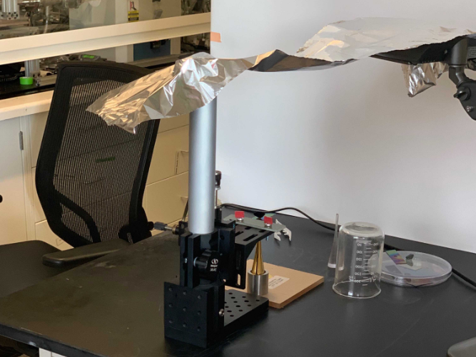 The diamond after CNT growth in MIT’s necstlab. The diamond is attached to the golden foot of the display in this processing step.